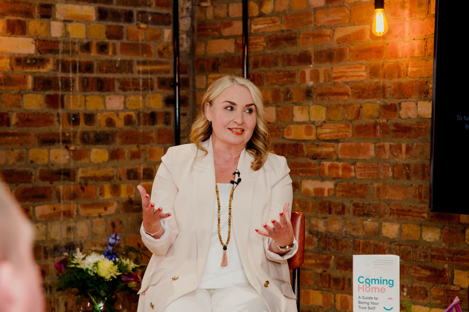 spiritual coach woman speaking on stage
